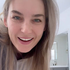 Creator leaning into camera excited about Nulastin Vibrant Scalp Treatment