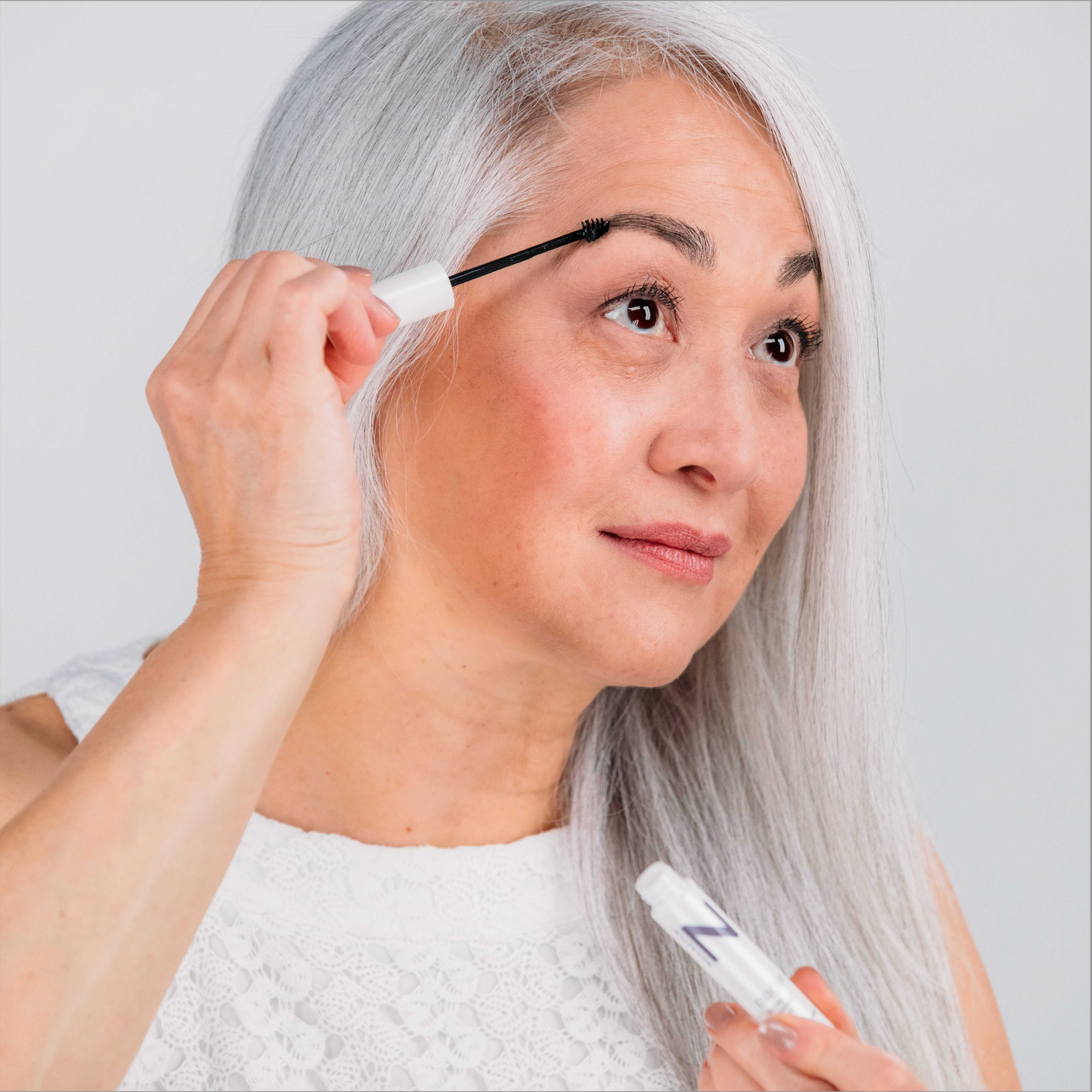 NULASTIN BROW Serum Being APplied to Customer Eyebrow