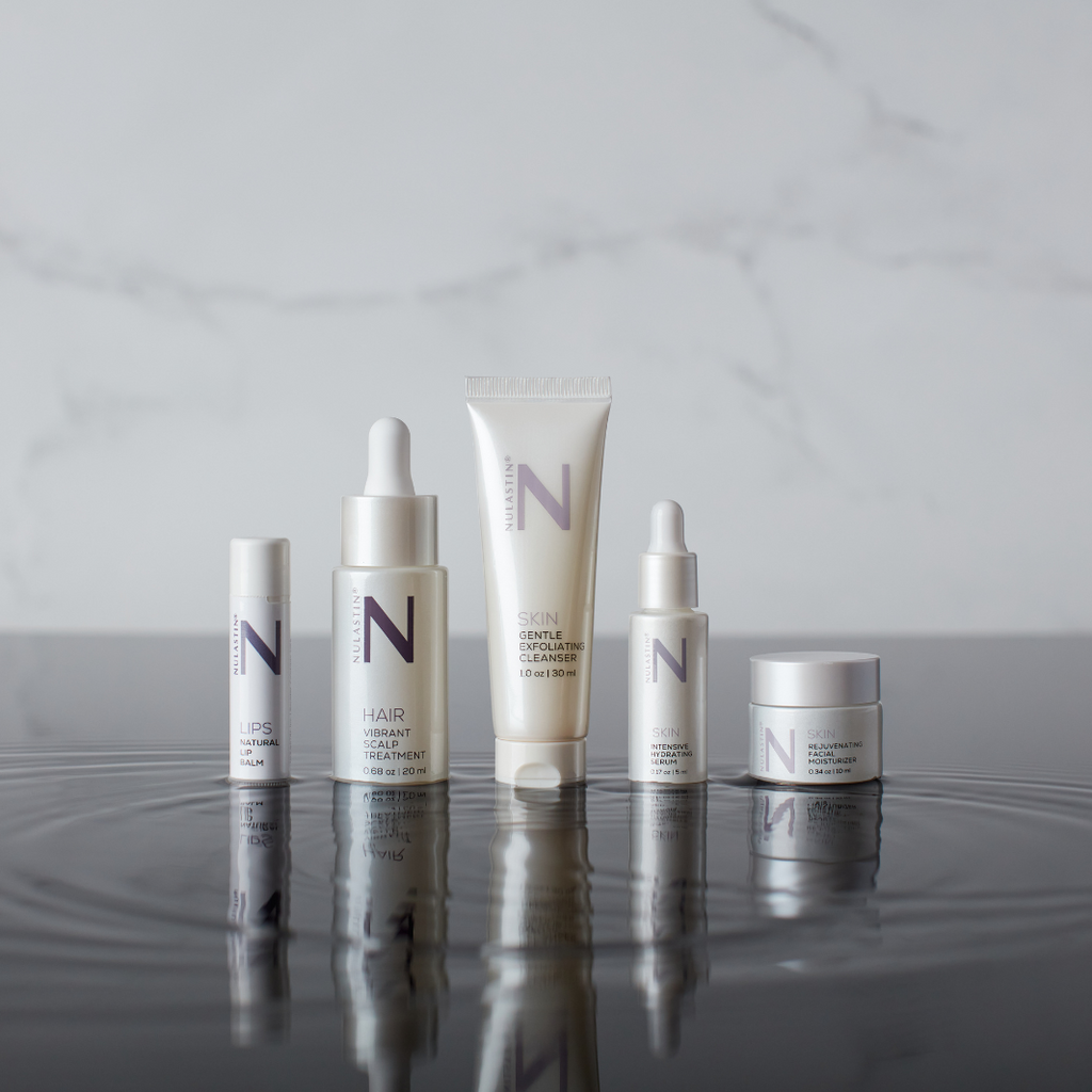 NULASTIN travel size collection on wet reflective surface