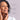 A list of skin benefits for Nulastin Rejuvenating Moisturizer with a woman touching her face