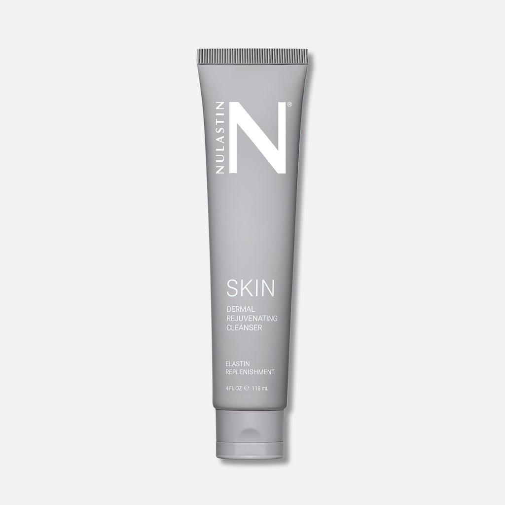 Front view of SKIN Dermal Rejuvenating Cleanser tube showing gray packaging and flip-top cap on white background