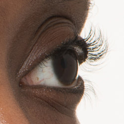 Close-up of an eye showing thicker, longer lashes after using NULASTIN lash serum