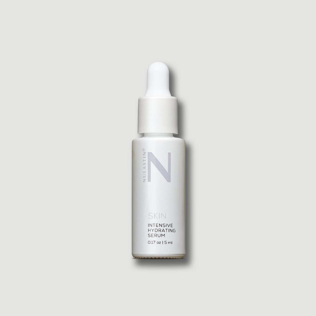 White travel size Nulastin Serum bottle on white background