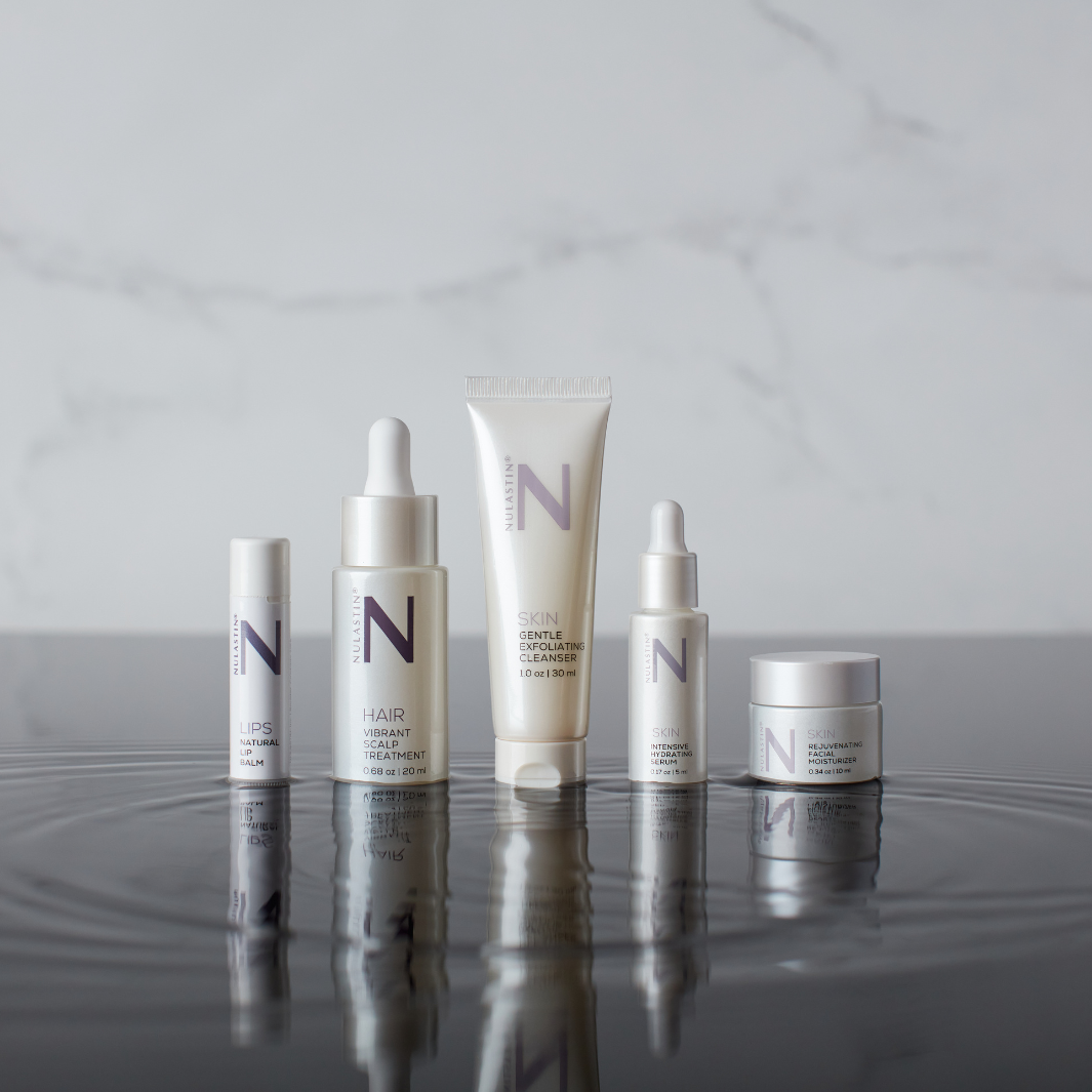 NULASTIN travel size collection on wet reflective surface 
