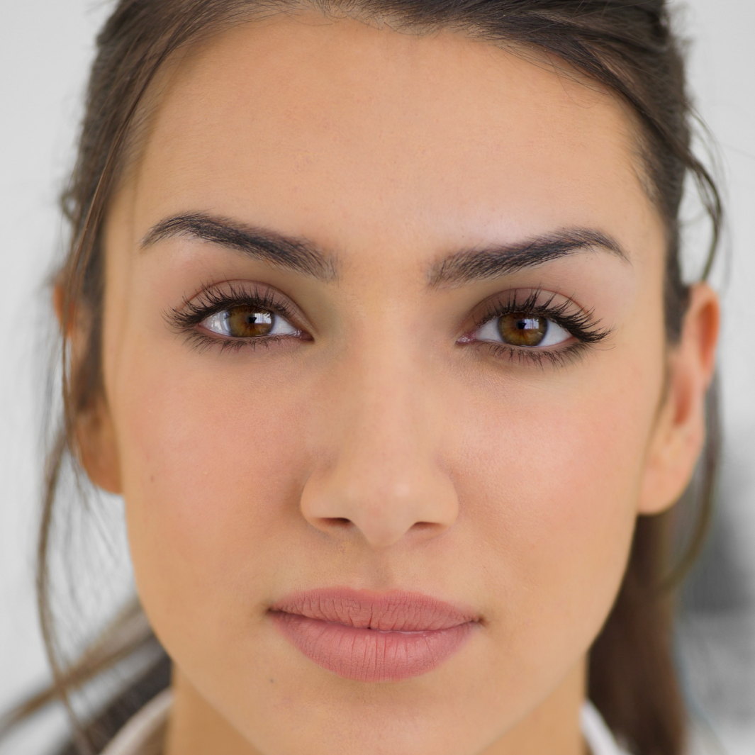 Woman with glowing skin showing NULASTIN skincare results