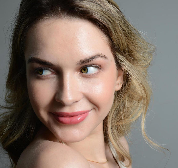Young woman feeling confident about her fuller looking lashes and brows