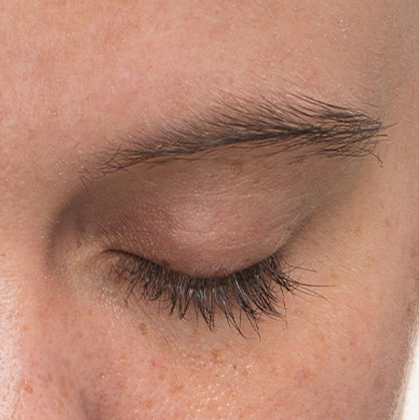 Close up of a woman's eyelash after using Nulastin LASH Follicle Fortifying Serum