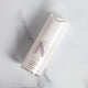 Bottle of radiance boosting Nulastin Hydrating Serum on a marble countertop